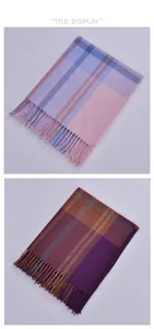 Close-up of pink and blue plaid cashmere scarf with soft tassels for autumn