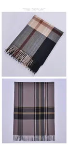 Detail view of colorful plaid scarves with tassels showing checkered patterns and soft texture