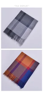 Detail of plaid scarves with fringe edges in grey-black and bright orange-blue patterns