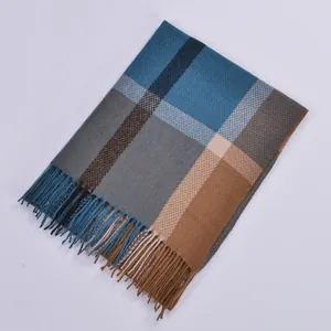 Close-up of blue and brown checkered cashmere-feel scarf with elegant fringe detail