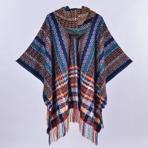 Ethnic knit hooded poncho featuring colorful plaid patterns and fringe tassel hem details