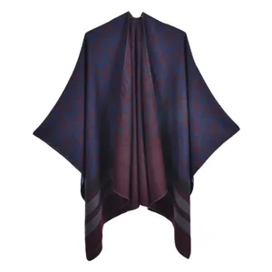 Double-sided knit poncho wrap with geometric pattern in navy blue and burgundy