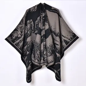 Women's knit shawl poncho with grey abstract mountain landscape pattern in thick fabric