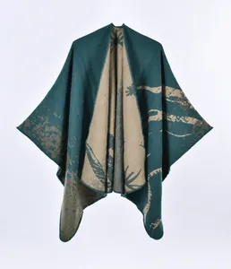 Detail of double-sided knit shawl featuring botanical patterns and stitched edges