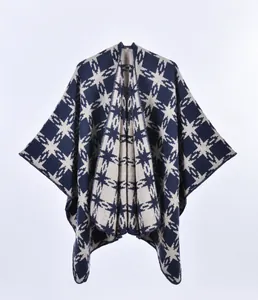 Detail of navy and beige geometric star pattern on knit shawl poncho with clean seams