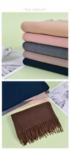 Close-up of winter scarves with fringe detail and soft twill texture in various colors