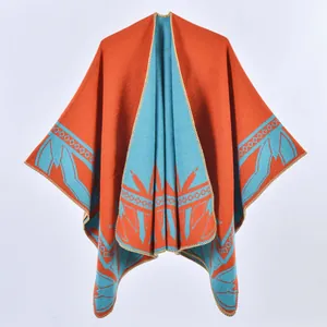 Orange and light blue thick knit shawl cape with geometric patterns for autumn and winter