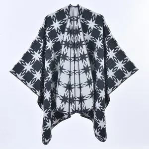 Close-up of black and white geometric pattern on soft cashmere-like knit cape