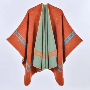 Detail of double-sided knit shawl showing ethnic geometric patterns and overlock edges