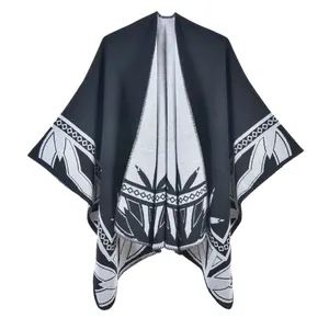 Thick knit poncho shawl with black and white ethnic geometric patterns and open front