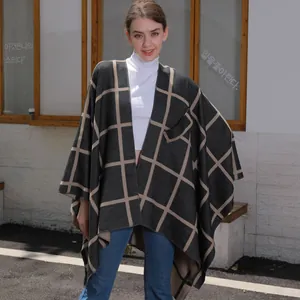 Plaid knitted poncho shawl with open front and pocket in dark grey and beige pattern