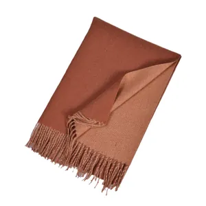 Soft faux cashmere scarf with double-sided camel tones and stylish tassel edges