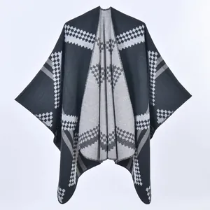 Women's knit shawl poncho with black grey and white geometric checkerboard pattern
