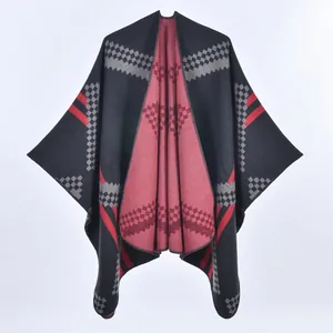 Women's knit poncho cape with red diagonal stripes and grey geometric pattern