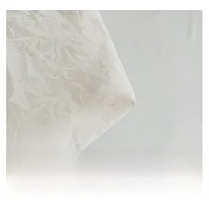 Close-up of premium white leatherette with natural crinkled texture for shoulder bag