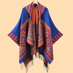 Bohemian hooded knit shawl cloak with vibrant floral patterns and black fringe tassels