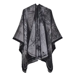 Women's knitted shawl in grey and black featuring intricate vintage jacquard patterns