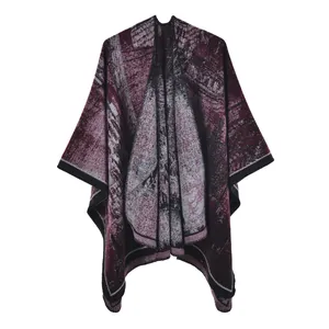 Women's knit poncho with burgundy ginkgo leaf jacquard pattern and black trim edge