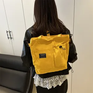 Large capacity bright yellow canvas tote bag with front pockets and fashion instinct label