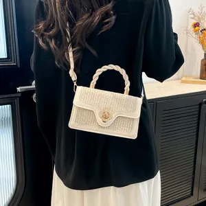 Chic woven beige small crossbody bag with gold flower clasp and top handle for women
