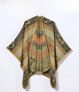 Detail showing Bohemian ethnic pattern knit shawl with golden embroidery and stitching