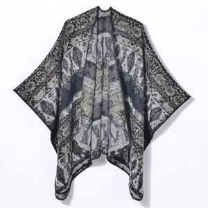 Retro geometric pattern knit poncho with vintage navy blue and beige tribal design