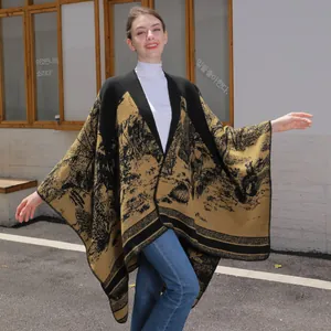 Landscape pattern knit shawl cape with landscape print in black and earth tones
