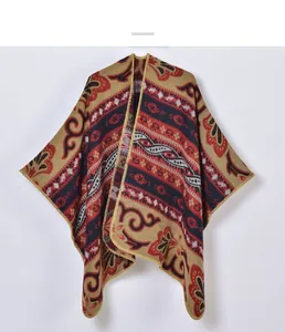 Detailed view of bohemian jacquard knit fabric with paisley patterns and golden trim