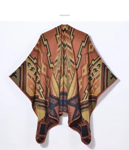 Close-up of geometric bohemian pattern on thick knit shawl cloak in earthy brown tones