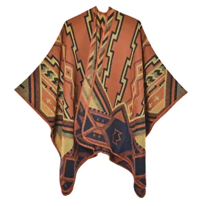Thick geometric jacquard shawl cape with bohemian tribal patterns and stitched edges