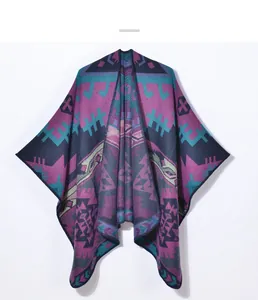 Detailed close-up of ethnic geometric knit texture on vintage purple winter poncho