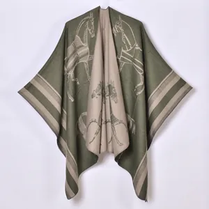 Detail of olive green and beige cashmere shawl with classic equestrian horse pattern