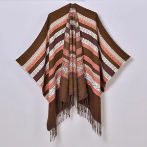 Bohemian knit shawl wrap with orange stripes, geometric patterns and tassel details
