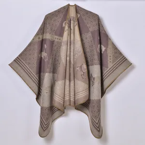 Detailed view of horse jacquard pattern and woven texture on this vintage knit poncho