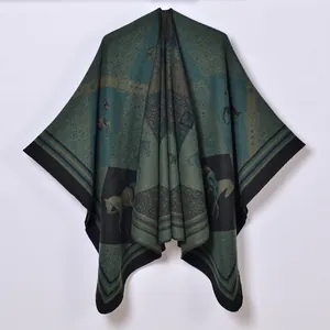 Vintage bohemian knit poncho cape featuring dark green horse silhouette and geometric patterns