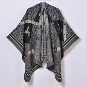 Women's vintage knit poncho with geometric patterns and horse motifs in black and gray
