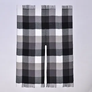 Classic black and white plaid poncho cape with split front design and fringe details