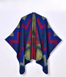 Detail of navy blue knit shawl featuring colorful geometric zigzag patterns and textures