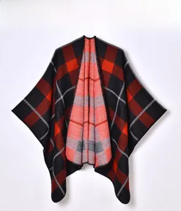Detail view of the red and black plaid knit shawl featuring premium hemmed edges