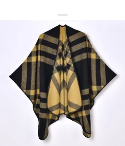 Close-up of yellow and black classic checked pattern on soft cashmere-like knit shawl