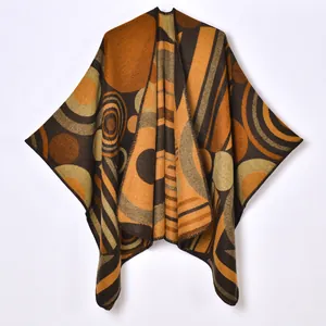 Women's warm knit poncho with geometric abstract patterns in earth-tone colors