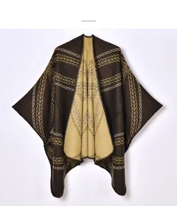 Detailed close-up of double-sided jacquard knitting pattern on a vintage shawl poncho
