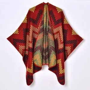Women's thick knit shawl cape with red geometric patterns and warm jacquard texture