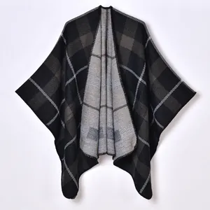 Women's vintage plaid knit poncho cape with classic grey check pattern for autumn