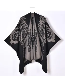 Close-up of thick knit paisley jacquard texture on this warm winter poncho wrap