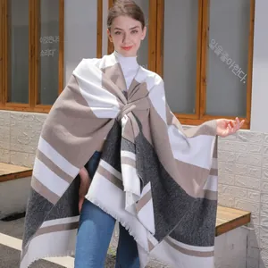 Striped fringe poncho shawl with color-block pattern and oversized winter style