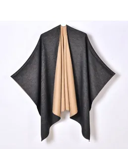 Detail of high-quality stitching on double-sided cashmere-like cape shawl for women