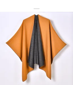 Detail view of double-sided knit shawl in ginger yellow and charcoal grey color