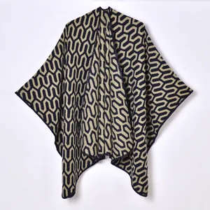 Navy blue and cream jacquard knit poncho cape with geometric pattern for autumn and winter