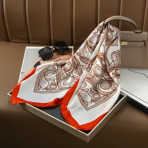 Vintage silk scarf with ethnic paisley print and orange border on white background